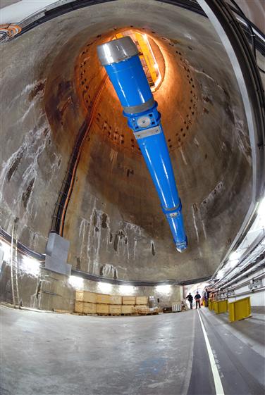 One of the  superconducting magnets is lowered into the LHC tunnel via a specially constructed pit 